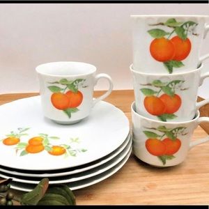 Four vintage luncheon plates with matching teacups